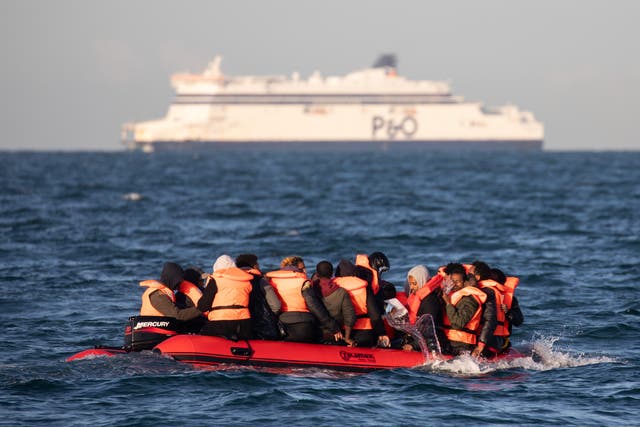<p>File photo: Asylum seekers in the Channel </p>