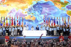 North Korean leader Kim shares center stage with Russian, Chinese delegates at military parade