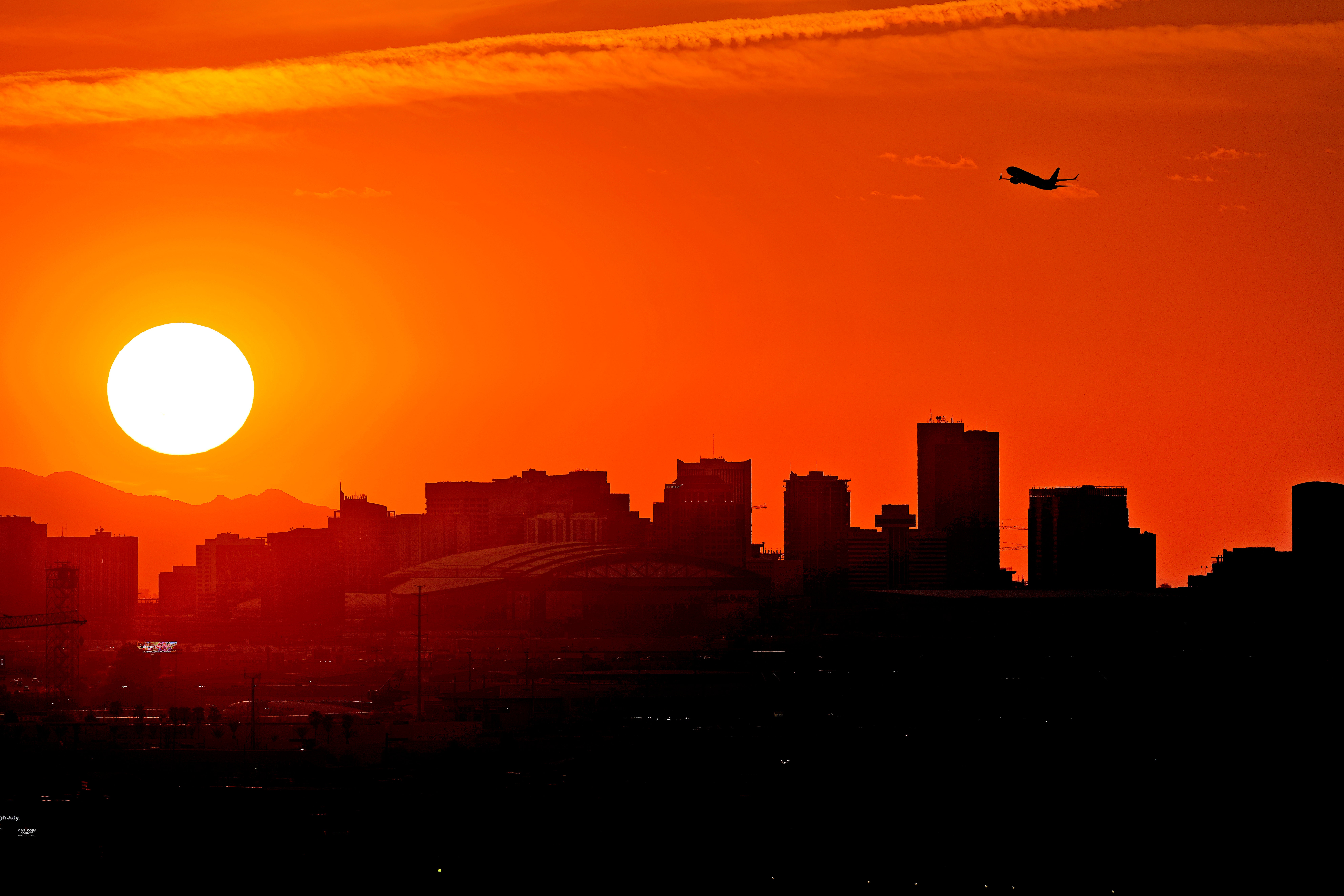 Phoenix swelters above 110F for entire month of July as wildfires erupt in California