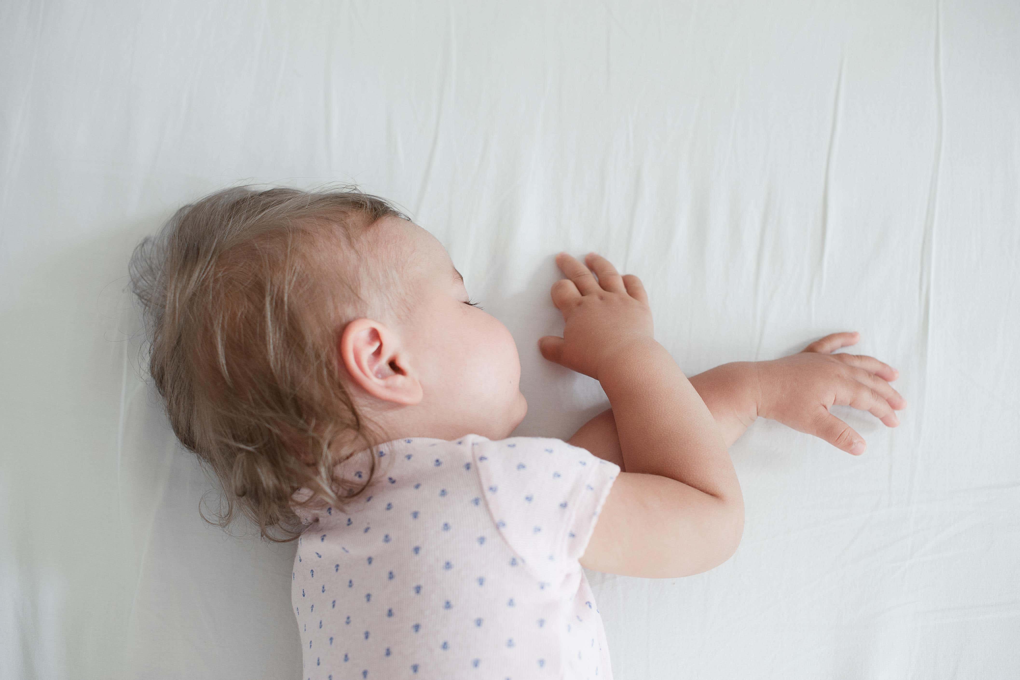 The charity said babies are safest sleeping on their back on a clear, flat, firm sleep surface