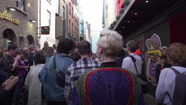 <p>Crowds gather at the Wall of Fame to pay tribute to Sinead O’Connor.</p>