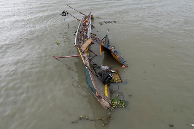 <p>This photo taken by drone shows the remains of a passenger boat that capsized in Binangonan, Rizal province, Philippines on Friday</p>