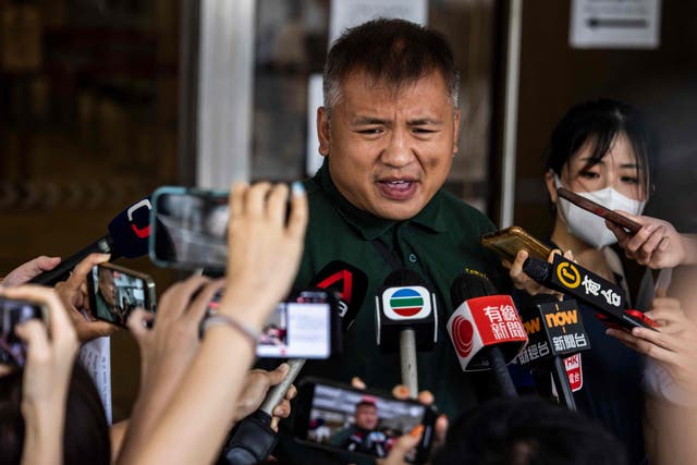 <p>Ronson Chan (C), journalist and chairman of the Hong Kong Journalists Association speaks with the media outside the High Court in Hong Kong </p>