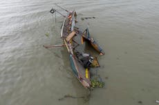 Philippine ferry was overloaded when it flipped over, leaving 26 dead, official says