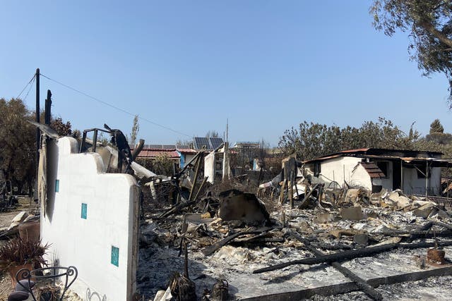 <p>Summer shock: several houses in the Rhodes resort of Kiotari were reduced to rubble and ashes by the wildfires on the Greek island </p>