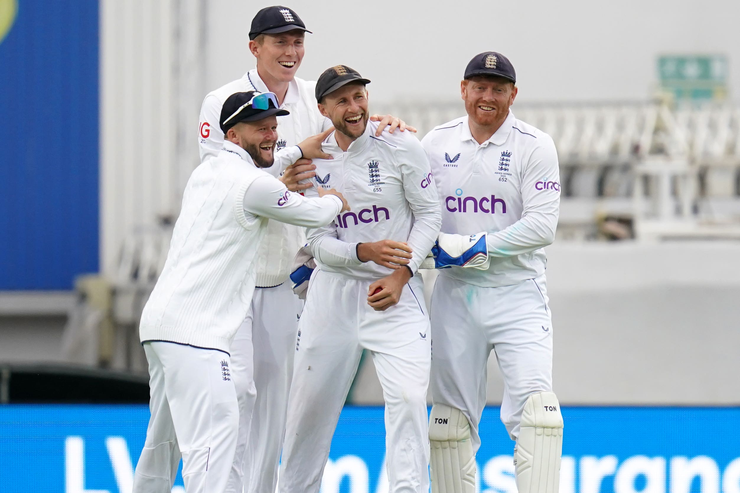 Joe Root (centre) celebrates catching Marnus Labuschagne (John Walton/PA)