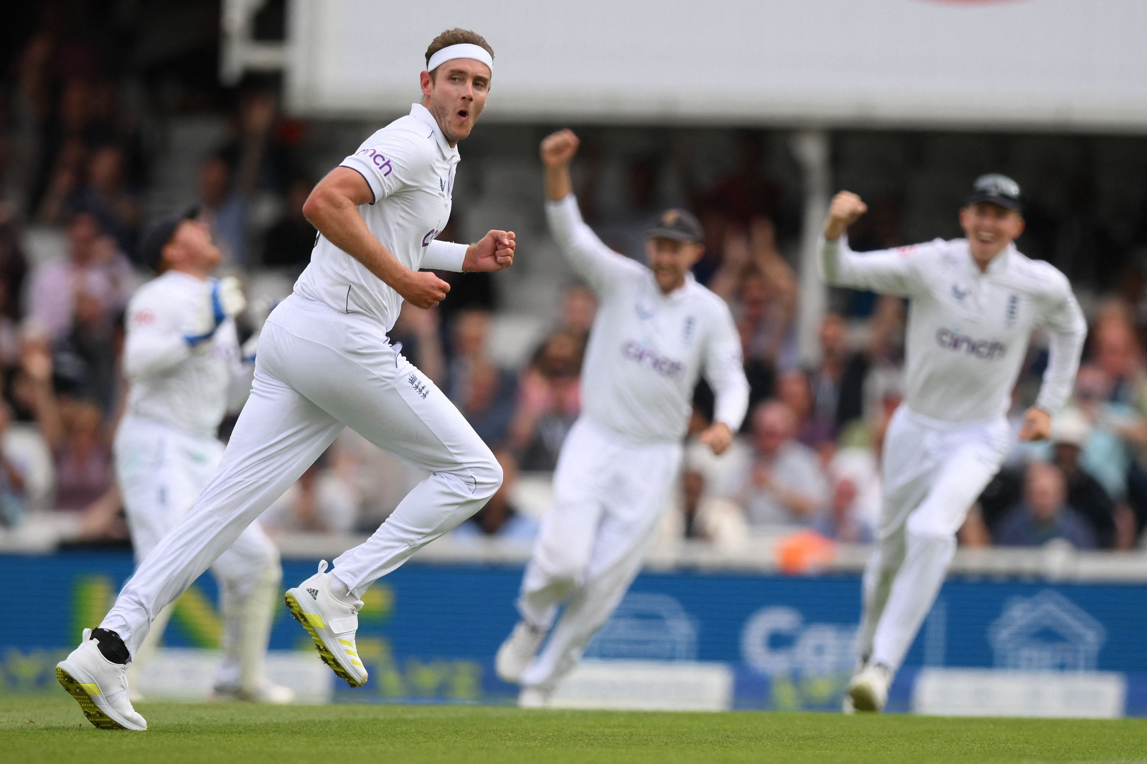 Broad celebrates after taking the wicket of Australia's Travis Head on day two