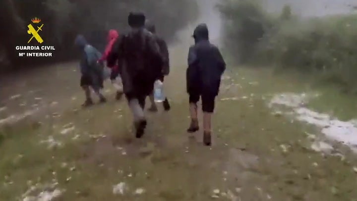 <p>Police rescue children from raging storm in Spain.</p>