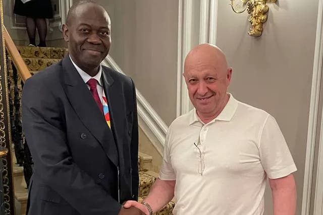 <p>Yevgeny Prigozhin, right, in St Petersburg during the Russia-Africa summit</p>