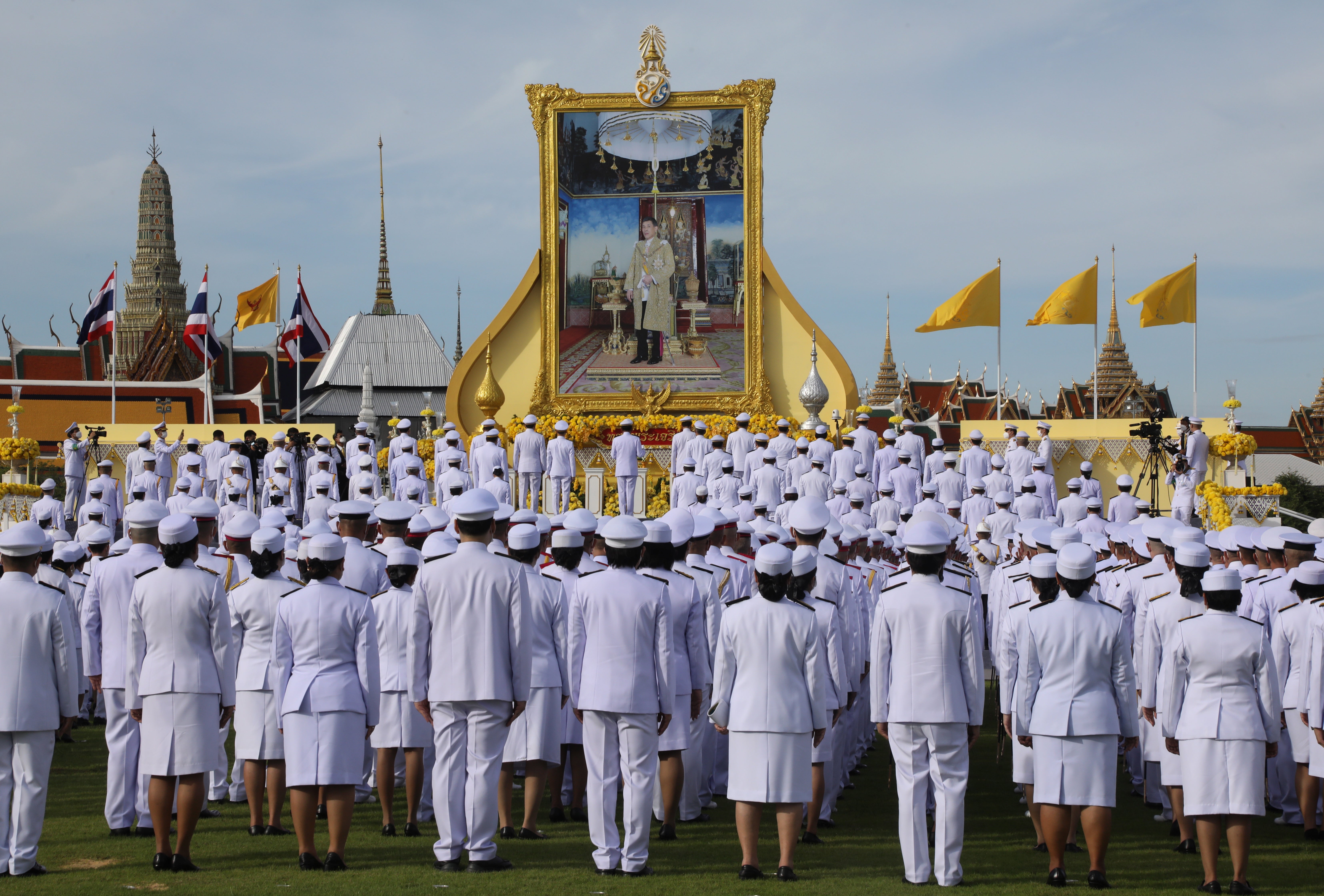 Thai caretaker Prime Minister Prayut Chan-o-cha (C) leads his cabinet and government officials in the salute to the portrait of Thai King Maha Vajiralongkorn Bodindradebayavarangkun during a ceremony for taking the oath of allegiance to become lawful civil servants, held to mark the king's 71st birthday at the royal grounds of Sanam Luang, outside the Grand Palace in Bangkok, Thailand, 28 July 2023