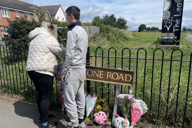 People leave flowers on Turnstone Road in Blakenall, Walsall (PA)