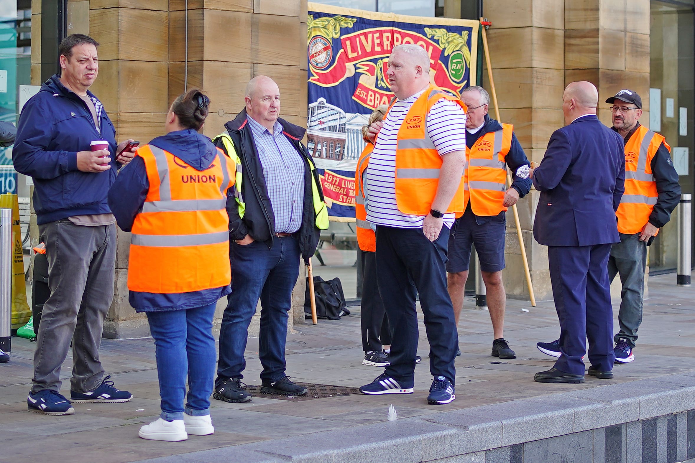 RMT mmbers on a picket line outside Liverpool Lime Street station (Peter Byrne/PA)