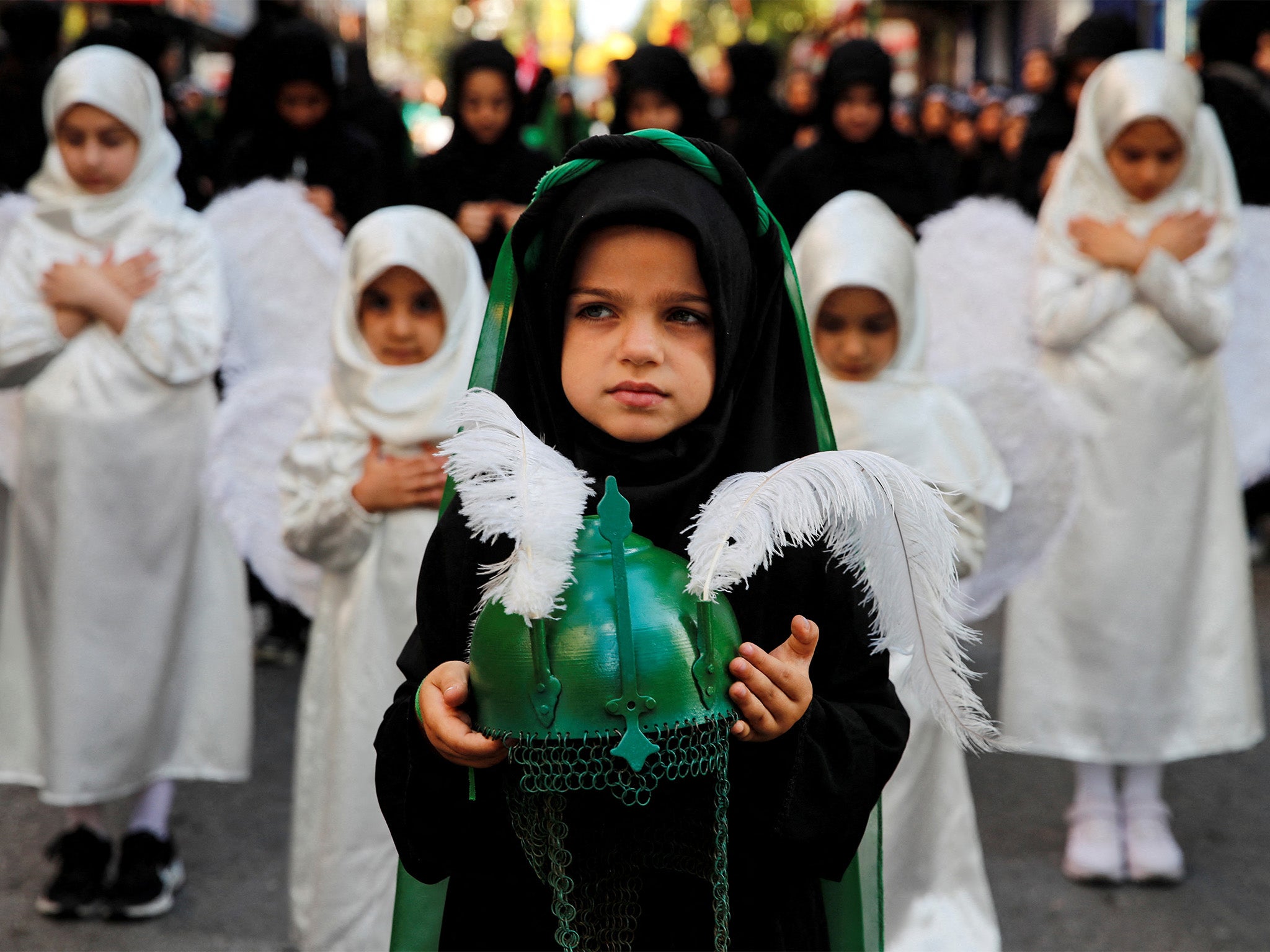 Young Shia Muslims take part in a mourning procession to mark Ashura, the holiest day in the Shia Muslim calendar, in Istanbul