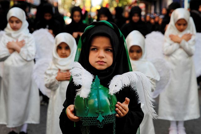 <p>Young Shia Muslims take part in a mourning procession to mark Ashura, the holiest day in the Shia Muslim calendar, in Istanbul</p>