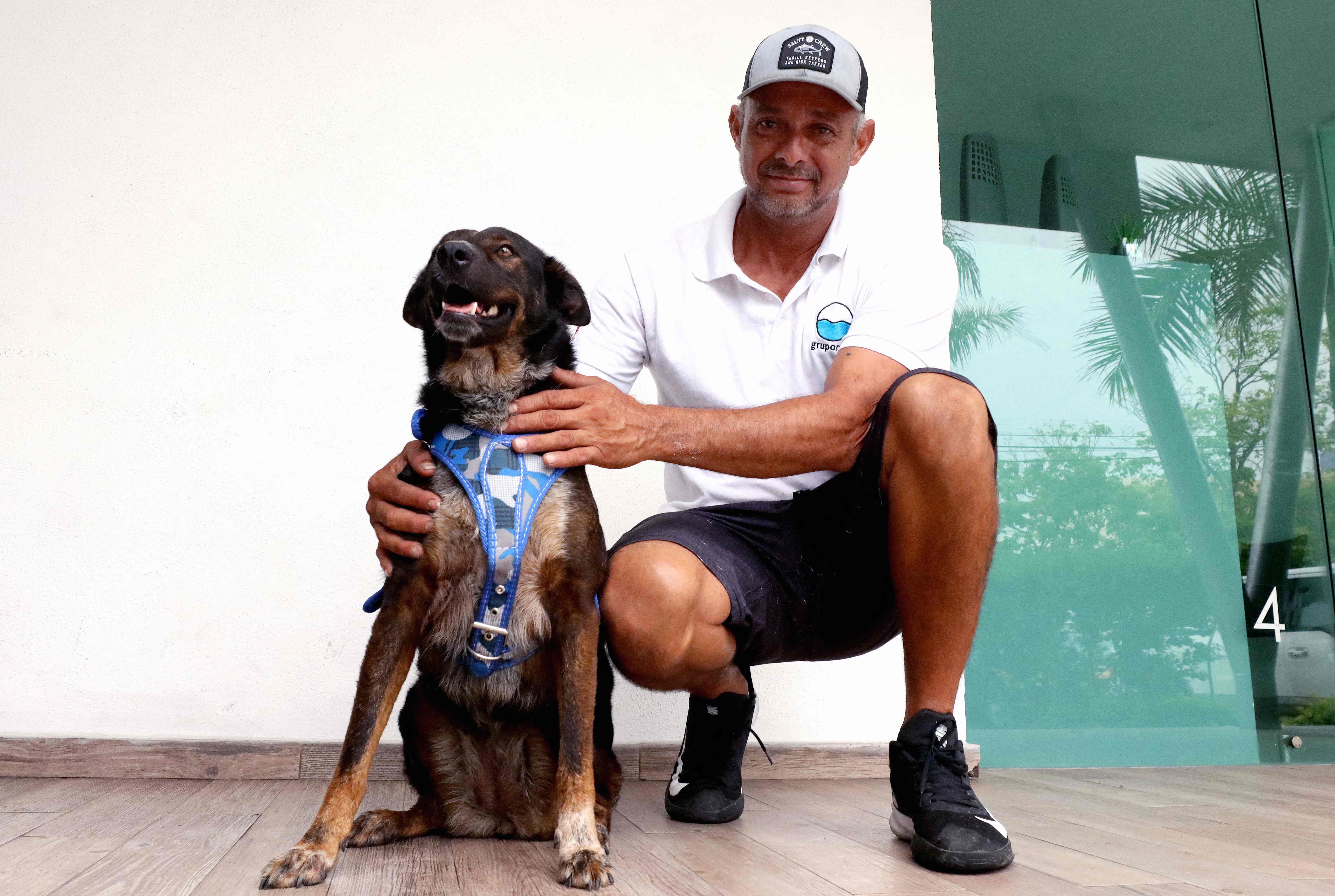 Fisherman Genaro Rosales, 48, a member of the rescue crew, will be adopting Bella