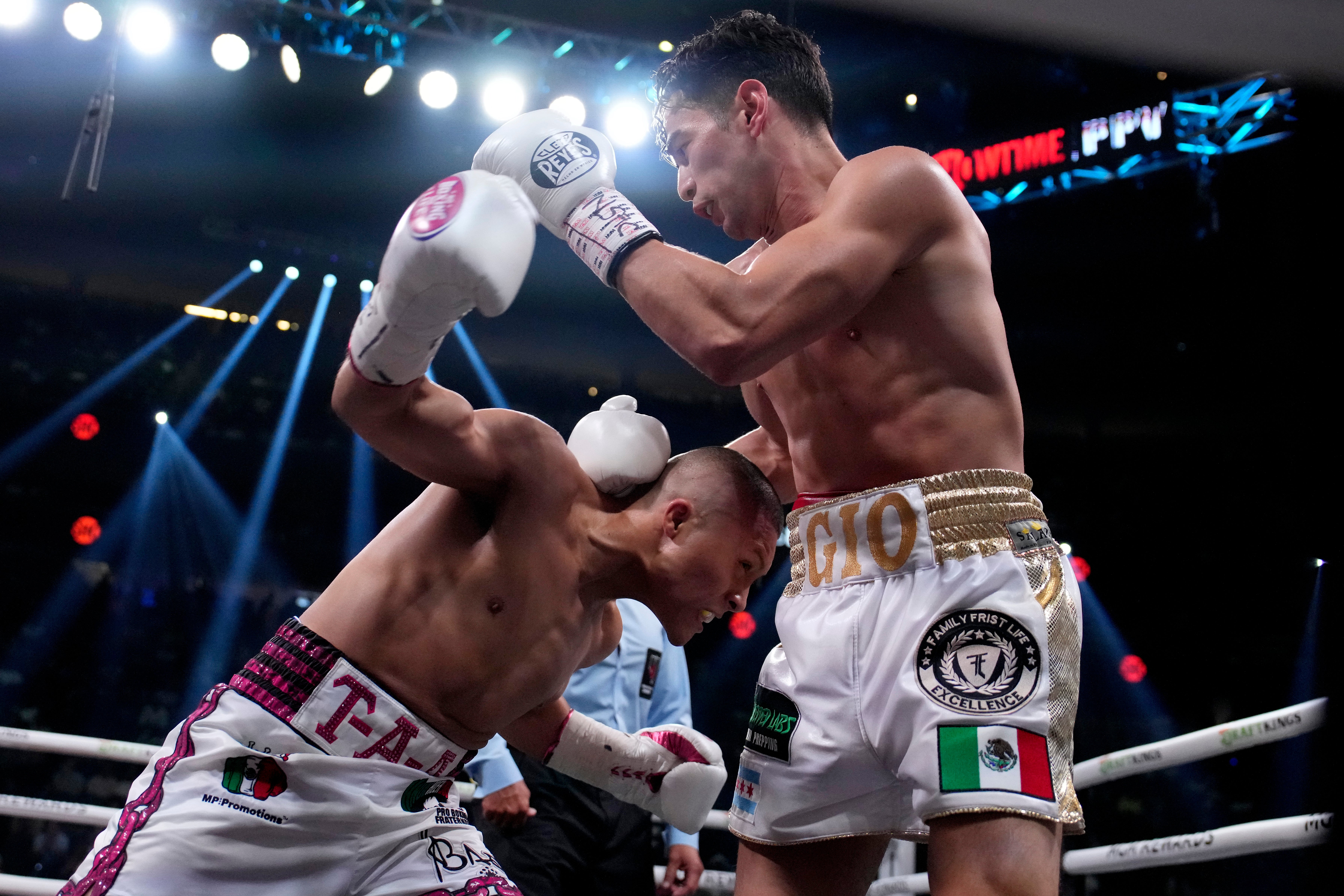 Isaac Cruz, left, and Giovanni Cabrera fight during their lightweight boxing match