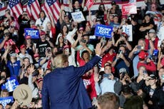 Trump, amid legal perils, calls on GOP to rally around him as he threatens primary challenges