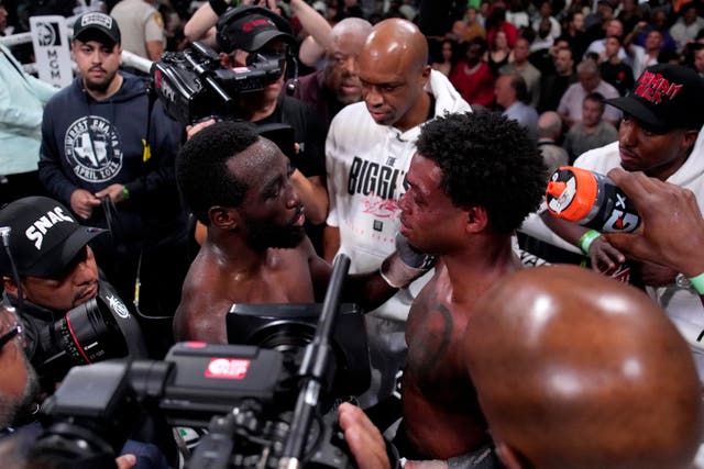 <p>Terence Crawford, left, and Errol Spence Jr share words of respect after their super-fight </p>