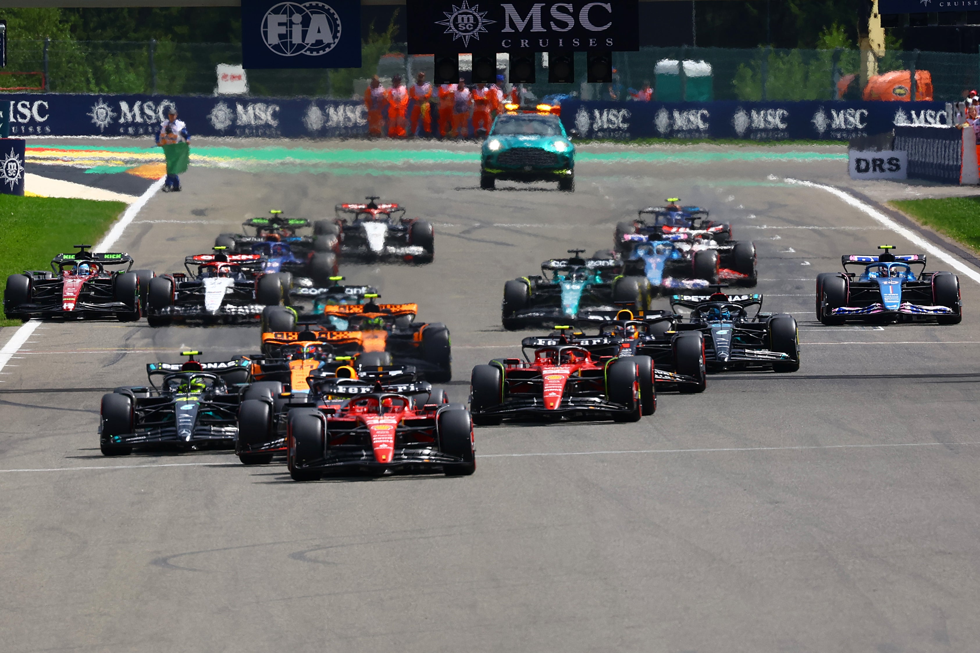 Charles Leclerc kept the lead at turn one but was soon passed by Red Bull’s Sergio Perez