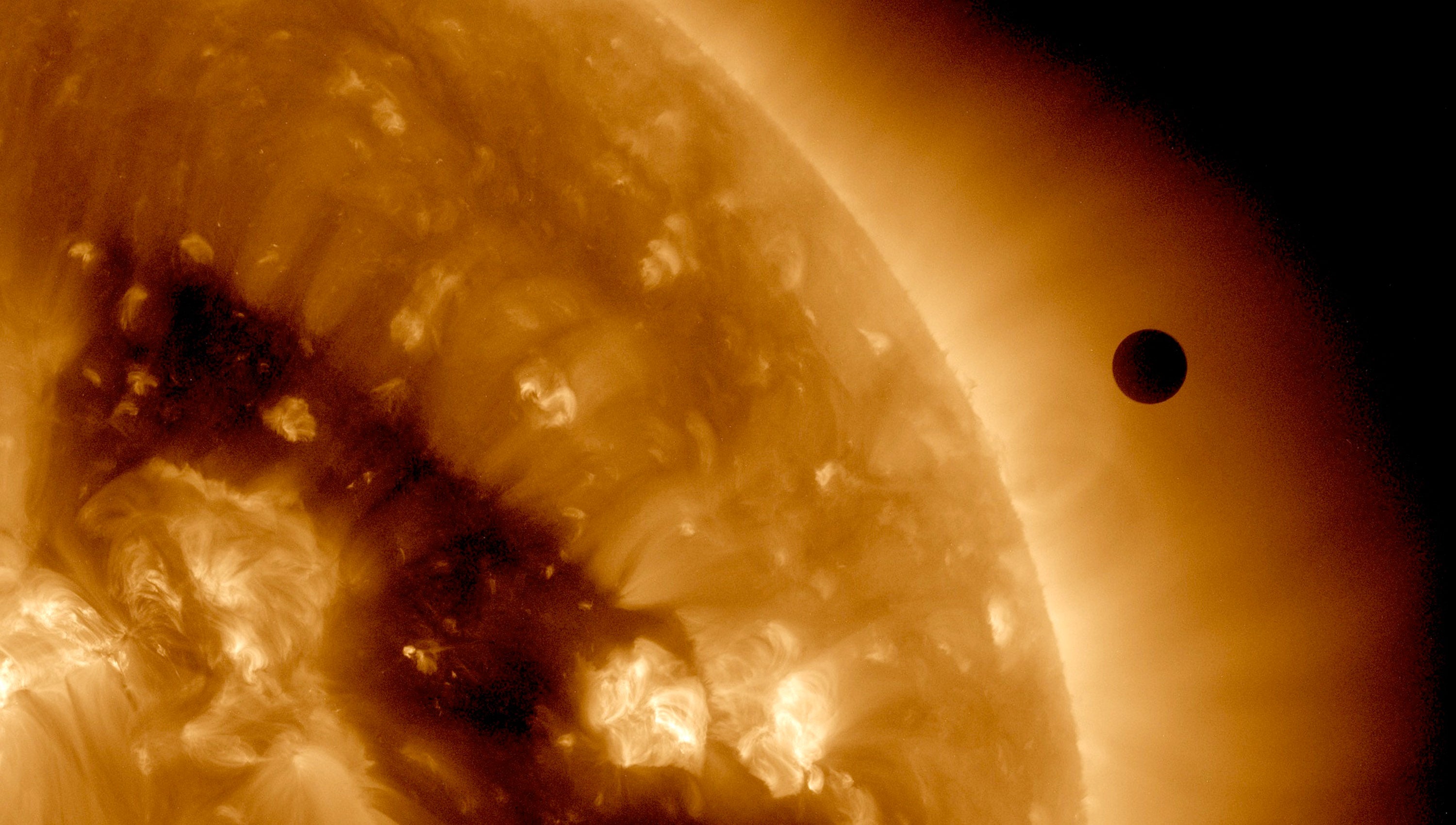 In this handout image provided by NASA, the SDO satellite captures a ultra-high definition image of the Transit of Venus across the face of the sun on June 6, 2012