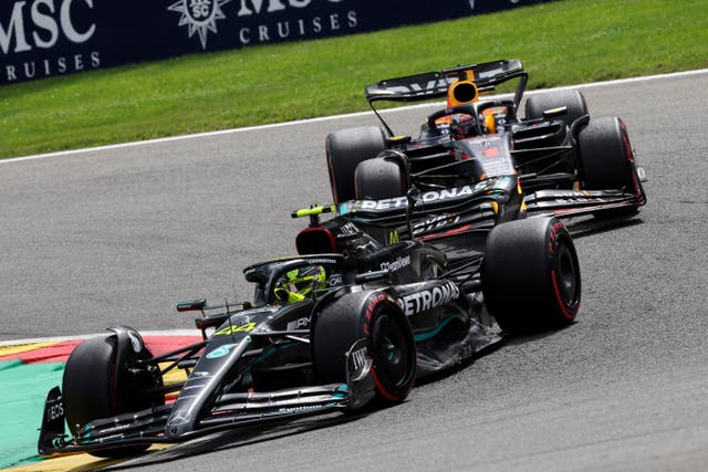 Mercedes driver Lewis Hamilton of Britain, left, and Red Bull driver Max Verstappen of the Netherlands steer their cars during the Formula One Grand Prix at the Spa-Francorchamps racetrack in Spa, Belgium, Sunday, July 30, 2023. (AP Photo/Geert Vanden Wijngaert)