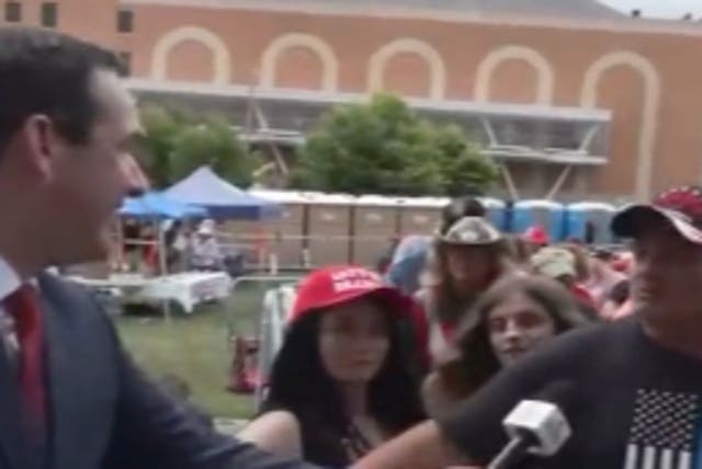 <p>Matthew Alvarez interviews a Trump supporter in Erie, Pennsylvania</p>