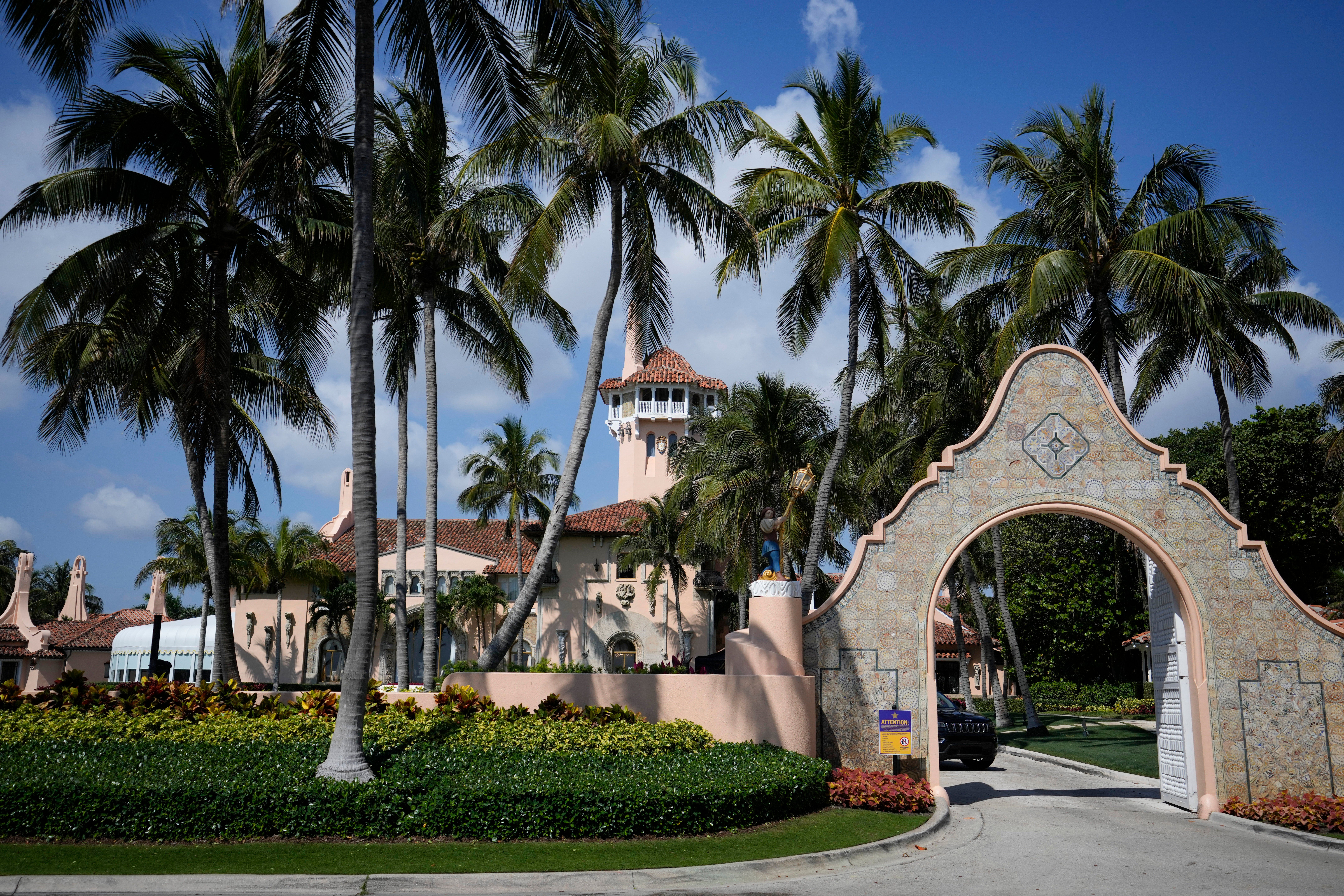 A security car blocks the drive at the entrance to former President Donald Trump’s Mar-a-Lago estate in Palm Beach