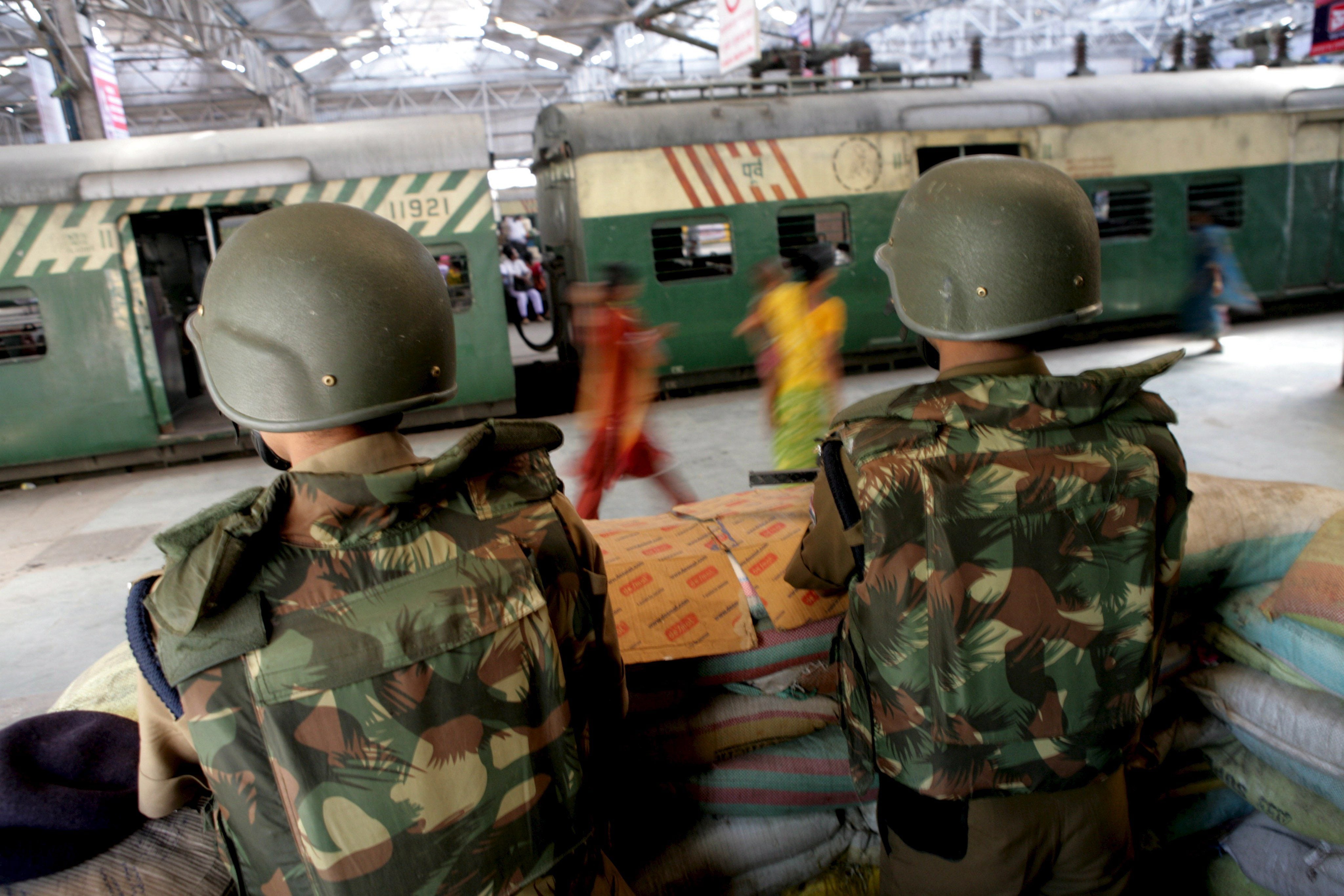Railway Protection Force (RPF) officials guard in a bunker on Sealdha Railway Station in Kolkata, India