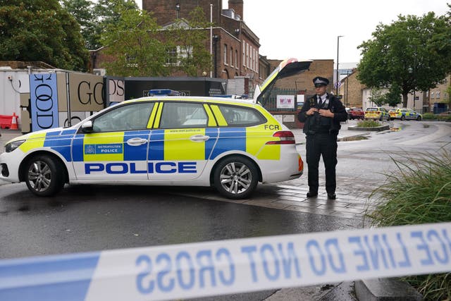 Police at the scene on White Hart Lane in Tottenham, north London (Lucy North/PA)