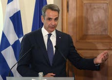 Greek prime minister seeks improved relations with Turkey but says Ankara needs to drop aggression