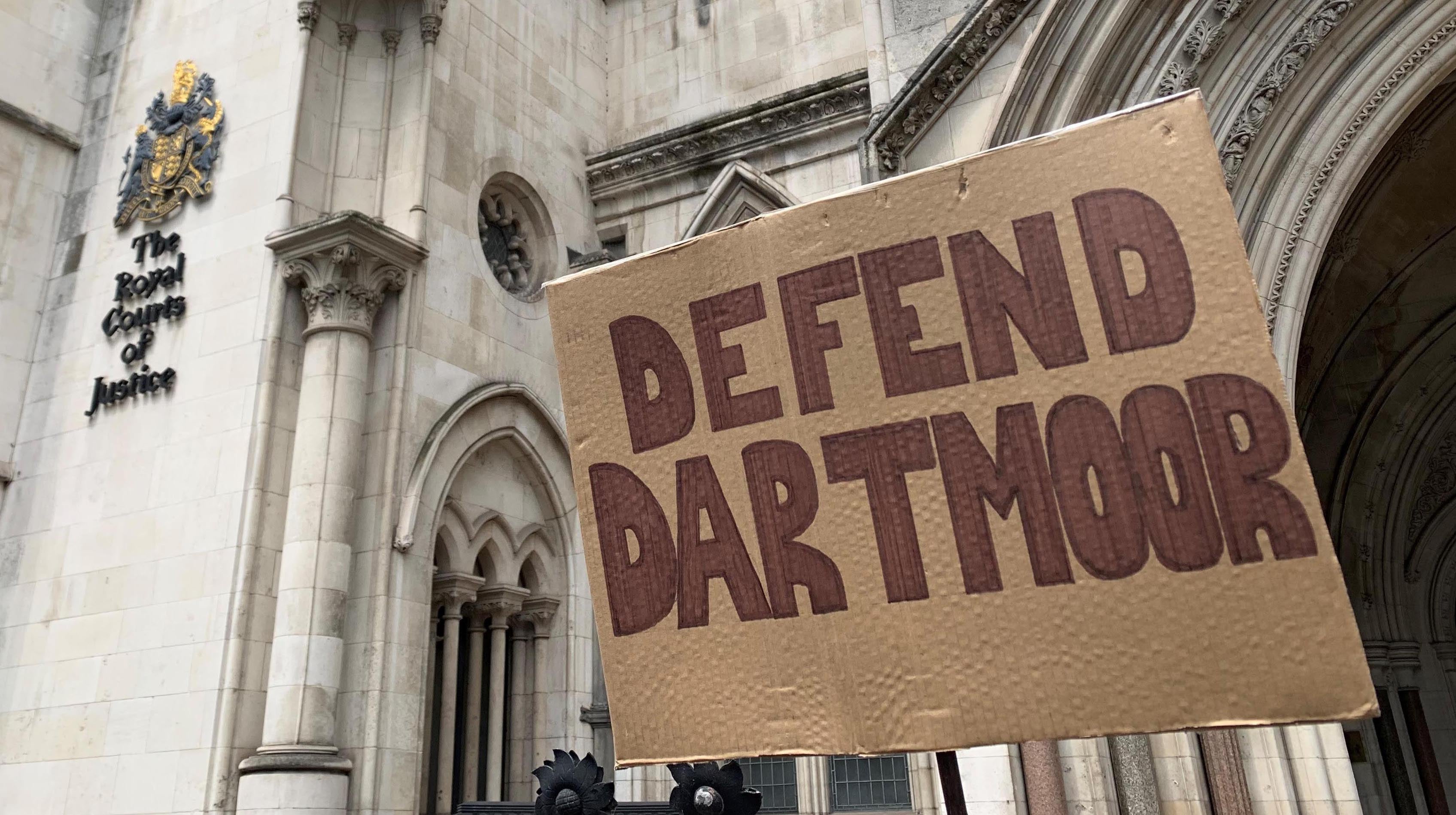 A crowd of protesters outside the Royal Courts of Justice, London