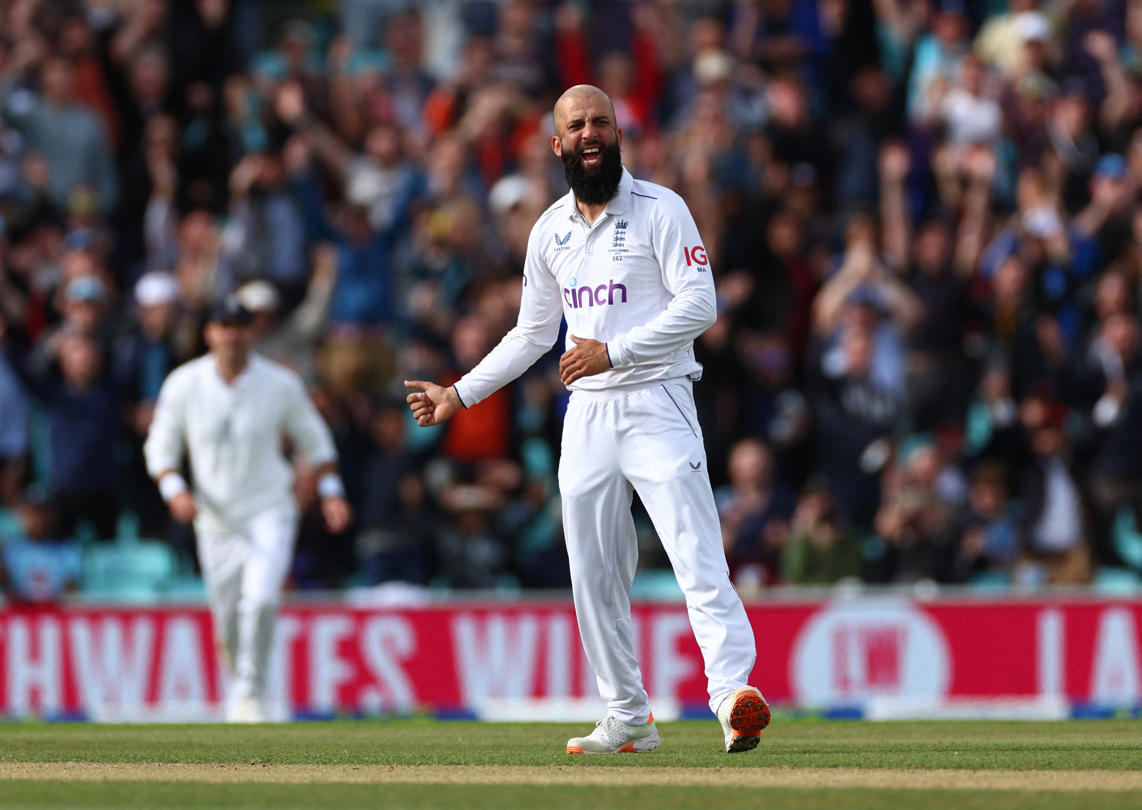 England’s Moeen Ali celebrates after taking the wicket of Australia’s Mitchell Marsh
