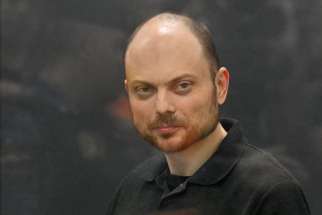 Russian opposition activist Vladimir Kara-Murza stands in a glass cage in a courtroom in Moscow (Dmitry Serebryakov/AP)