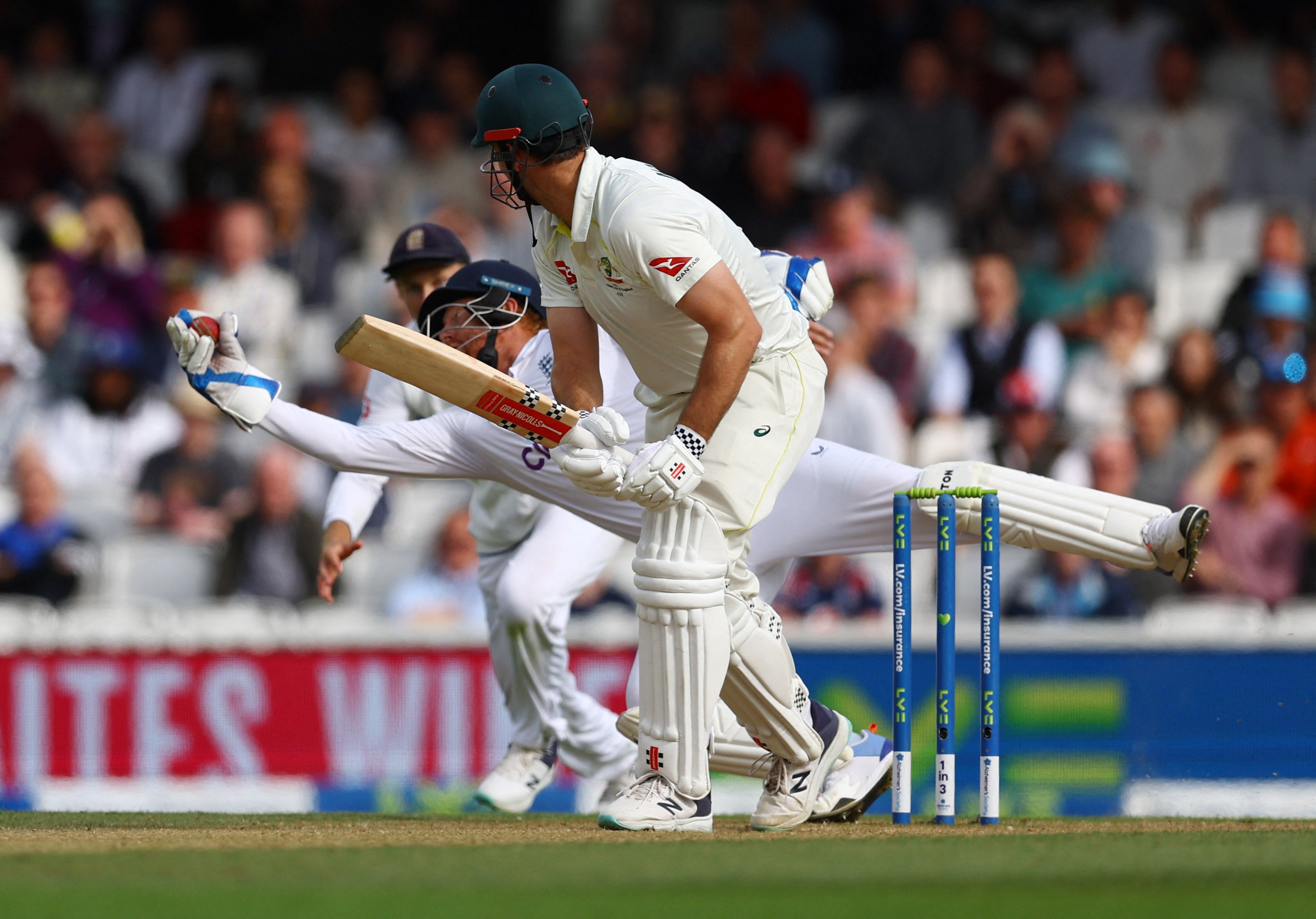 England's Jonny Bairstow takes a catch to dismiss Australia's Mitchell Marsh