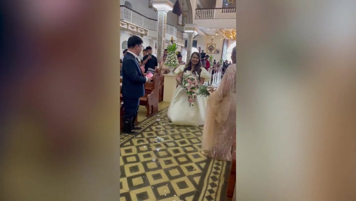 ‘It didn’t matter’: Bride walks down flooded aisle after Typhoon Doksuri hits Philippines