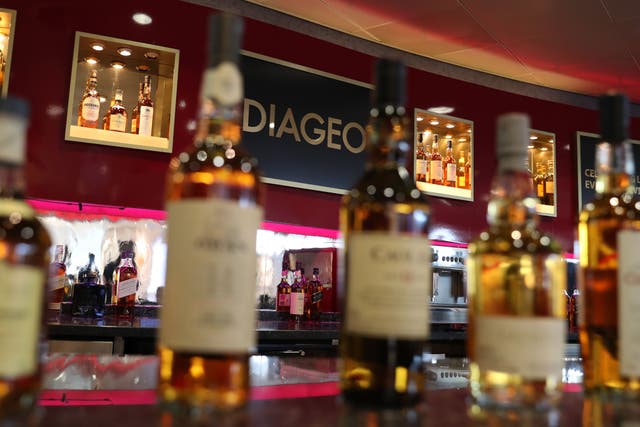 Johnnie Walker and Smirnoff owner Diageo has seen half-year profits boosted by price rises and as drinkers switch to more expensive brands (PA)