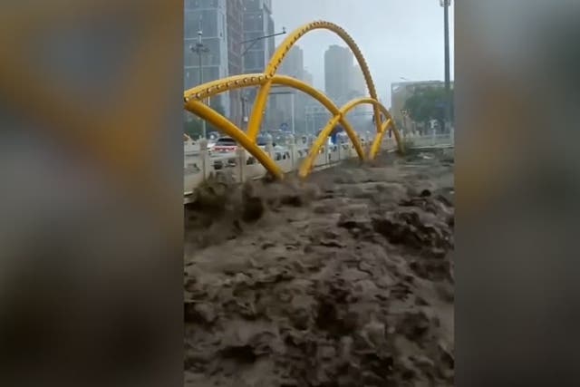 <p>River rages in Beijing after Typhoon Doksuri makes landfall.</p>