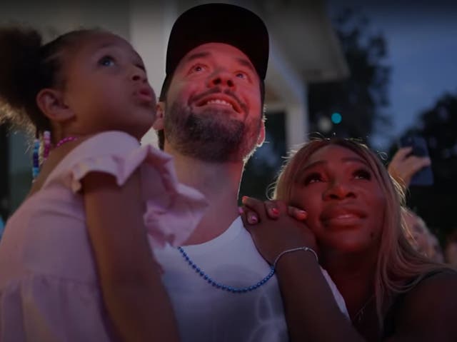 <p>Alexis Ohanian and Serena Williams hold their five-year-old daughter Olympia as they watch a drone display at their gender reveal party</p>