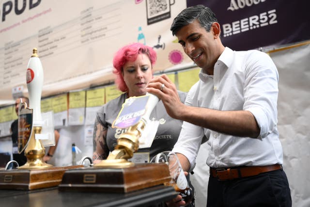 Prime Minister Rishi Sunak was heckled over the alcohol duty changes while visiting the Great British Beer Festival at Olympia, in London (Daniel Leal/PA)