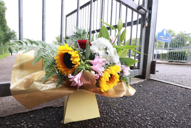 Flowers outside Largy College in Clones after two pupils were killed in a crash (Liam McBurney/PA)