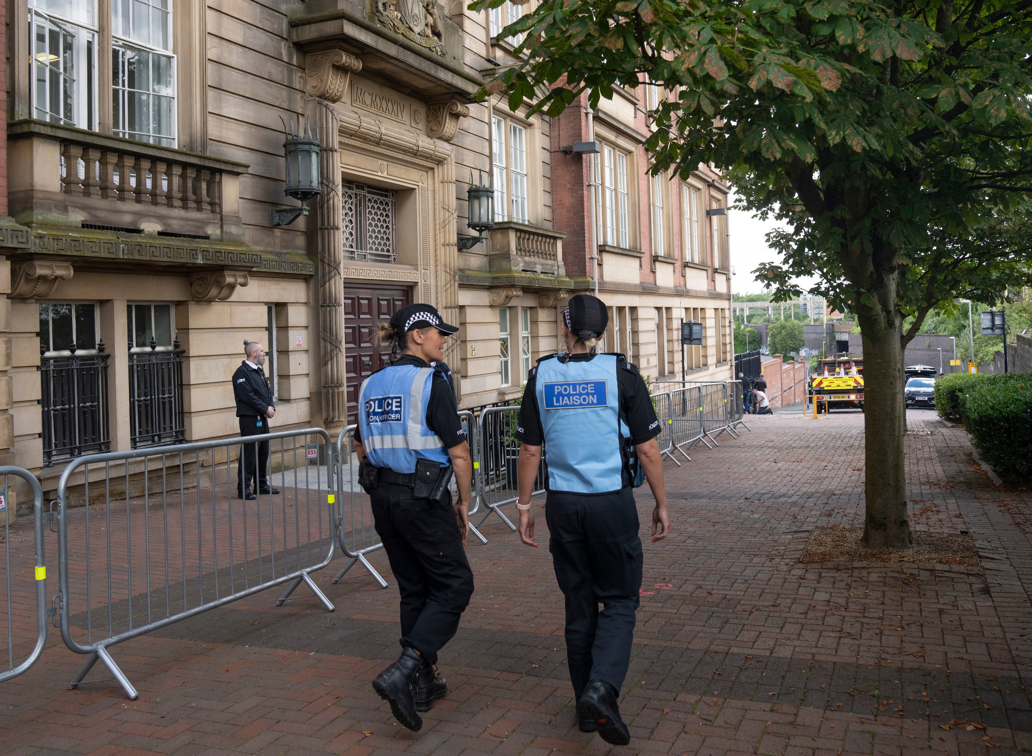 Police Liaison officers patrolled outside County Hall in Preston on the first day of the inquest