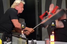 Wrestling legend hits rival with guitar during radio interview