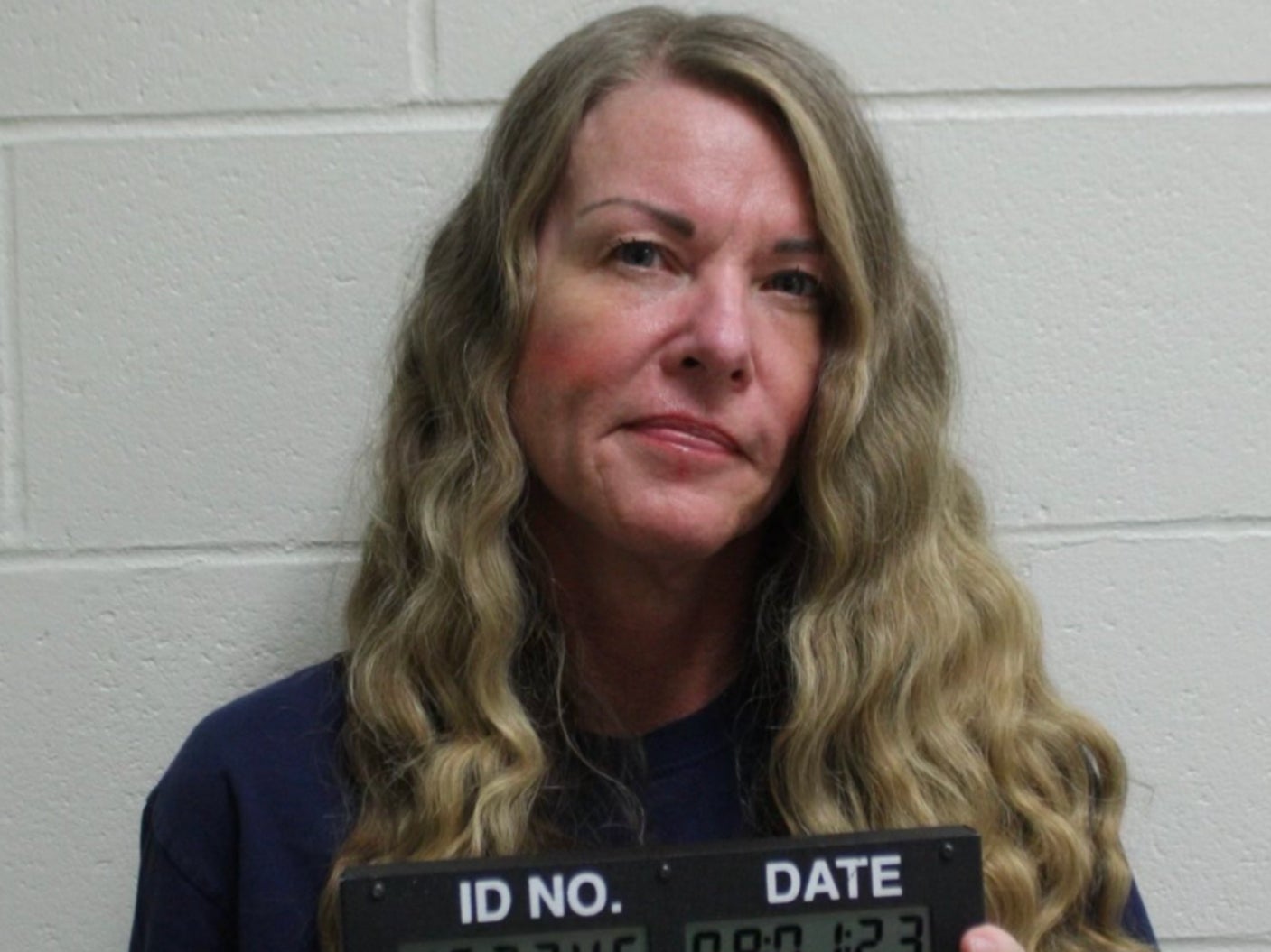 Lori Vallow smirks in her new mug shot after being handed life without parole