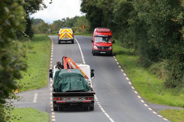 The scene on the N54 Clones to Smithborough road at Legnakelly, Co Monaghan, as a vehicle is removed after two teenage pupils from Largy College in Clones were killed in a road traffic collision (Liam McBurney/PA)