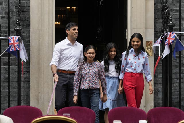 <p>Rishi Sunak, with his wife, Akshata Murty, right, believes he can convince his daughters about his oil and gas plans (Frank Augstein/PA)</p>