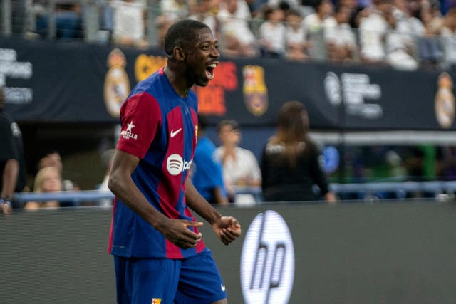 Ousmane Dembele celebrates scoring for Barcelona (Jeffrey McWhorter/AP).