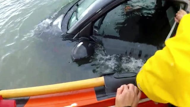 <p>Lifeguards desperately search a submerged van for driver and passengers.</p>