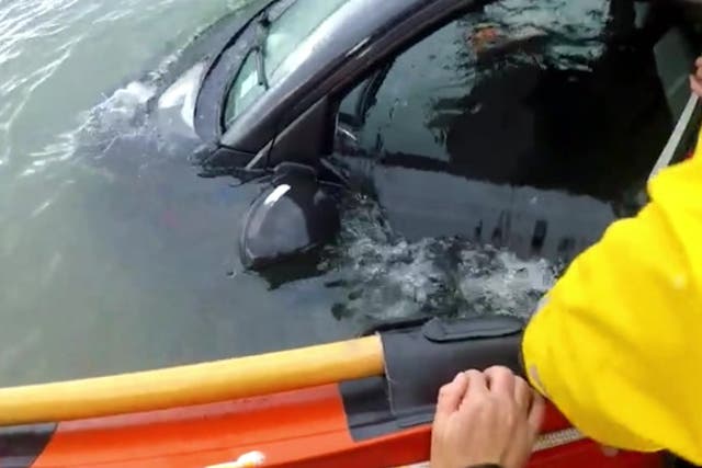 <p>Lifeguards desperately search a submerged van for driver and passengers.</p>