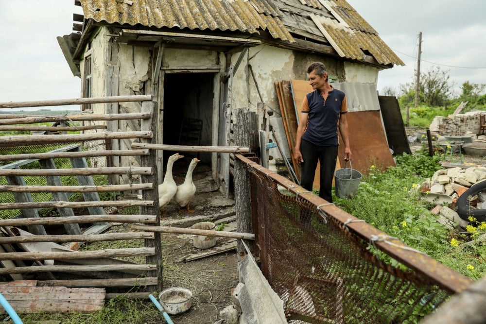 Mykola, 58, feeds geese in Bohorodychne village