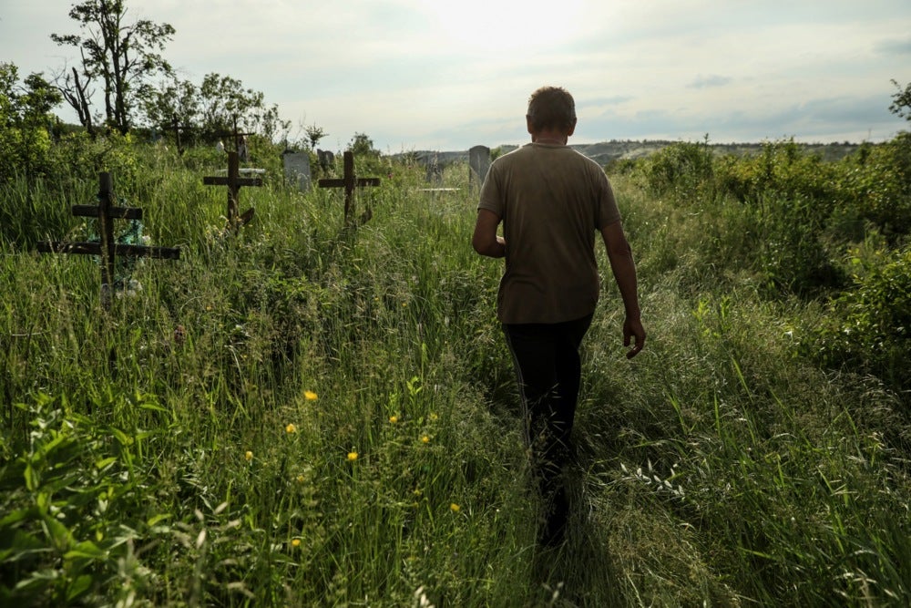 Walking through the cemetery to his brother’s grave – Vasyl was killed as Russian and Ukrainian forces clashed in July last year